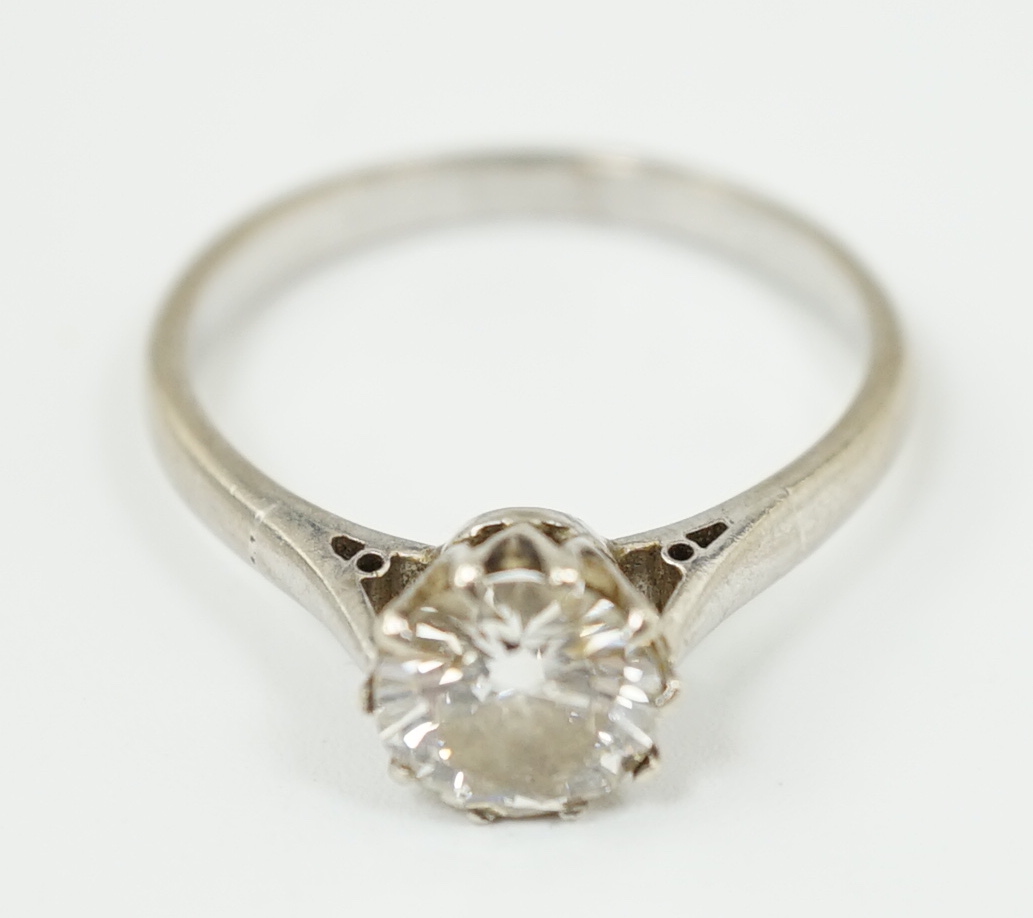 A white gold and solitaire diamond set ring